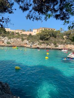 many people are swimming in the blue water