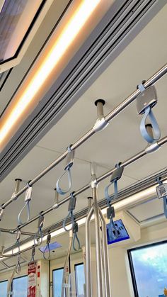 the inside of a train car with multiple lights on each side and no people in it