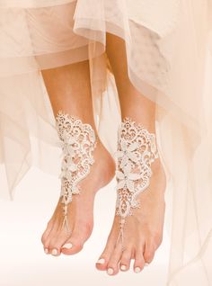 One of a kind, Zaria Barefoot Sandals are unique lace barefoot sandals that will look absolutely ravishing on your wedding day at the beach. These absolutely gorgeous foot jewels are carefully handmade using white French lace, white ribbons, white plated chain, and some flower applique to extenuate your gorgeous pedi. When wearing Zaria Sandals you will truly feel like a princess. The intricate detail of the lace design looks stunning on, and can be worn in the pool or in the water. Feel 100% co Lace Barefoot Sandals, Lace Bridal Shoes, Barefoot Sandals Wedding, Beach Wedding Sandals, Beach Wedding Shoes, Crochet Barefoot Sandals, Barefoot Sandal, Lace Sandals, Wedding Shoes Lace