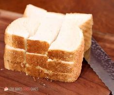 slices of bread on a cutting board with a knife