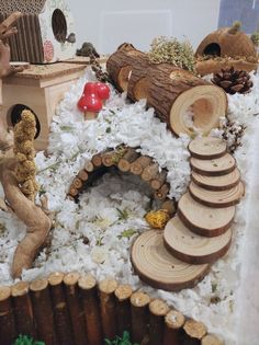 a close up of a cake made to look like a log cabin with trees and logs