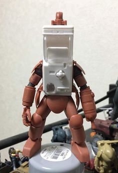 a toy robot standing on top of a table