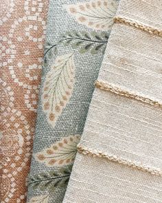 four different fabric samples are stacked together on top of each other in this close up photo