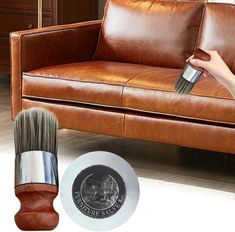 a brown leather couch with a brush on it