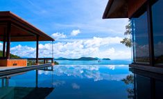 a pool with the words we stay chill in front of it and an ocean view