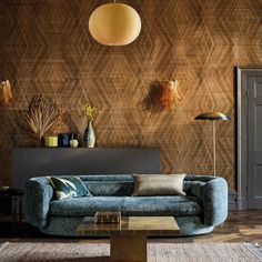 a living room filled with furniture and walls covered in wood paneled wallpapers