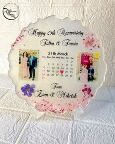 • Customized wedding anniversary gift with preserved pictures in resin. • Perfect for celebrating anniversaries and creating lasting memories. • High-quality resin plaque measuring 8 by 8 inches. • Ideal for displaying cherished moments in a unique and elegant way. • Personalized and thoughtful gift for your loved ones. • Preserves pictures in stunning resin art for a timeless keepsake.  “Celebrating love’s timeless beauty with a touch of elegance. Our wedding anniversary gift encapsulates cherished memories in a rose gold base adorned with real flowers and delicate pink chunks. 💖✨ #AnniversaryGift #ResinPlaque #RoseGoldElegance”  We are Specialized to make customized resin designs🎨  For More Details Content Us📱 WhatsApp 🟢 0305 9499953  #alkousarresinart #weddinganniversary #anniversar Resin Art Anniversary Gift, Wedding Anniversary Gifts For Parents Diy Cute Ideas, Resin Art Wedding Gift, Resin Anniversary Gift, Wedding Resin Art