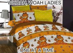 a bed with winnie the pooh comforter and pillow cases on top of it