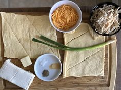 some food is laying out on a cutting board