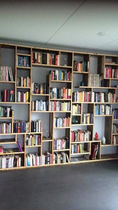 an empty room with bookshelves full of books