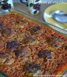 a casserole dish with meatballs and tomato sauce