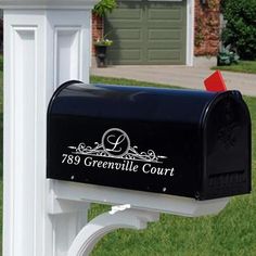 a mailbox in front of a white post with the words greenville court on it