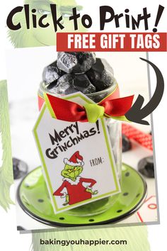 a jar filled with blackberries sitting on top of a green plate next to a red ribbon