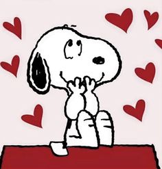 a drawing of a snoopy dog sitting on top of a table with hearts around him