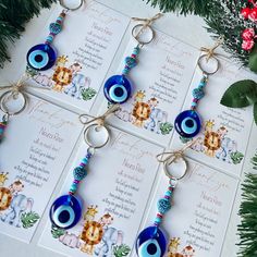 the evil eye keychains are decorated with beads