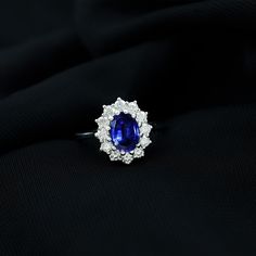 Product Details This Stunning and Classic Ring is embellished with Oval Shaped Lab Created Blue Sapphire Solitaire encircled with Small Round Shaped Diamond stones set as Halo in Prong Setting. The ring is crafted with Gold. Express your love by presenting this ring to your lady. Product Information SKU SHP-RINGS122035970 Width 5.7 mm Height 13.8 mm Weight 2.48 gm (Approximate) LAB CREATED BLUE SAPPHIRE INFORMATION No.of Stones 1 Pieces Total Weight 1.55 Carat (Approximate) Dimension(approx) Oval-6X8 mm-1 Pcs Color Blue Cut Brilliant Shape Oval Setting Type Prong-Setting Quality Grade AAAA DIAMOND INFORMATION No.of Stones 12 Pieces Total Weight 1.08 Carat (Approximate) Dimension(approx) Round-2.40X2.40 mm-12 Pcs Color HI Cut Brilliant Shape Round Setting Type Prong-Setting Quality Grade SI Sapphire Solitaire Ring, Sapphire Solitaire, Ring With Diamond, 18k Yellow Gold Ring, Signature Jewelry, Timeless Jewelry, Classic Ring, Conflict Free Diamonds, Diamond Stone