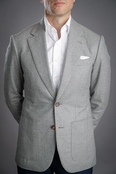 Flannel is traditionally made from a carded/woolen wool or worsted yarn. Flannel may be brushed to create extra softness like in this case, or remain un-brushed. By brushing the fabric, it creates a beautiful and sophisticated marbling you see, giving more depth to this classic light grey.

Dry-clean only. Classic Gray Wool Blazer, Timeless Gray Wool Blazer, Classic White Wool Blazer, White Poplin Dress, He Spoke Style, Grey Flannel, Dark Denim Jeans, Poplin Dress, White Solid