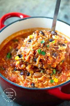 a red pot filled with chili and beans