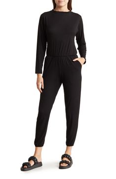 Go casual in this one-and-done jumpsuit fashioned with an elastic blouson waist and cinched elastic hems. Crewneck Long sleeves 90% modal, 10% spandex Hand wash, dry flat Made in the USA of imported fabric Model stats: 5'10" height, 32" bust, 25" waist, 36" hip. Model is wearing size Small. Black Elastane Jumpsuits And Rompers For Loungewear, Relaxed Fit Jumpsuit With Elastic Waistband For Loungewear, Stretch Jumpsuits And Rompers With Elastic Waistband, Casual Stretch Jumpsuits And Rompers For Loungewear, Casual Stretch Jumpsuits For Loungewear, Stretch Jumpsuits And Rompers For Fall Loungewear, Casual Long Sleeve Solid Jumpsuits And Rompers, Chic Jumpsuit With Elastic Waistband For Loungewear, Chic Loungewear Jumpsuits With Elastic Waistband