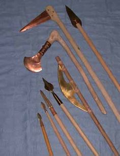 an assortment of tools are laid out on a blue sheet with white cloth behind them