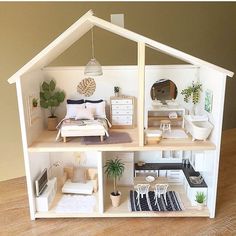 a doll house with furniture and accessories in it