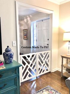 a living room with a blue and white dresser