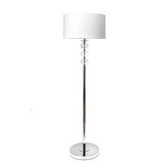 a floor lamp with a white shade on the base and a silver plated base