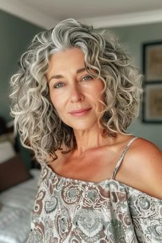 40 Grey Curly Hair Hairstyles to Highlight Your Best Features Growing Out Grey Hair Styles, Medium Length Curly Gray Hair, Curly Grey Hair Over 50, Grey Curly Hair Over 50, Growing Out Curly Hair, Gray Curly Hair Natural Curls, Curly Gray Hair Over 50 Curls, Short Curly Grey Hair, Curly Grey Hair Natural Curls