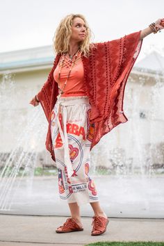 The Indie Kimono in Rust Our Indie Kimono is a perfect staple for any on-trend bohemian style outfit! Pair with any dress, top, pants, or skirt, along with some pieces of beautiful bohemian style jewelry! Our Indie Kimono is made of 100% acrylic fabric and features a total length of 38", and also can be machine-washed in cold water. For reference the model, and owner Spirit, is wearing the one size. Her height is 5'6 Weight is 124 Red Bohemian Bottoms For Vacation, Bohemian Red Bottoms For Vacation, Bohemian Boho Print Bottoms For Beach Season, Bohemian Fall Festival Bottoms, Bohemian Summer Festival Bottoms, Flowy Bohemian Bottoms For Beach Season, Bohemian Flowy Beach Bottoms, Bohemian Rayon Bottoms For Summer, Bohemian Style Rayon Bottoms For Summer