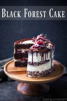 a black forest cake on a wooden plate