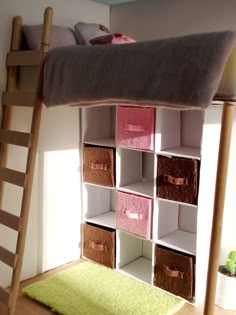 there is a bunk bed with many boxes on the bottom shelf and a green rug underneath it