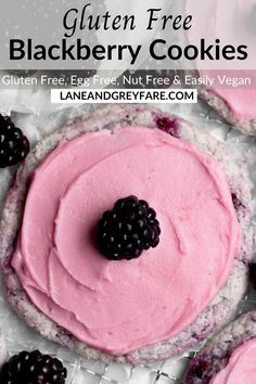 blackberry cookies with pink frosting and fresh blackberries on top are the perfect dessert