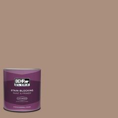 a can of behrut ultra stain - blocking paint and primer in brown