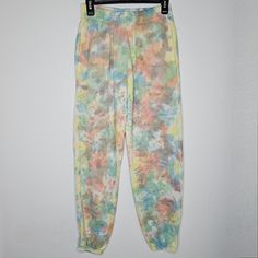 Add A Splash Of Color To Your Wardrobe With These Vibrant Tie-Dye Jogger Pants! Perfect For Lounging At Home Or Running Errands, These Pants Offer Both Comfort And Style. Key Features Include: - Soft, Breathable Fabric That Feels Great Against The Skin - Elastic Waistband For A Secure Fit - Stylish And Unique Tie-Dye Pattern In Pastel Colors - Ideal For Casual Outings Or Cozy Days In. Elevate Your Casual Wear With These Eye-Catching Joggers! Acid Wash Pants With Elastic Waistband In Relaxed Fit, Acid Wash Pants With Elastic Waistband And Relaxed Fit, Acid Wash Relaxed Fit Pants With Elastic Waistband, Multicolor Elastic Waistband Sweatpants For Loungewear, Acid Wash Bottoms With Elastic Waistband For Loungewear, Spring Acid Wash Bottoms With Pockets, Multicolor Relaxed Fit Sweatpants, Pink Wide Leg Joggers For Spring, Pink Wide Leg Spring Joggers