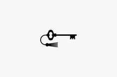 a black and white photo of an old key