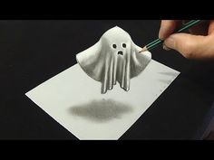 someone is drawing a ghost with pencils