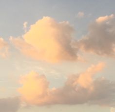 two airplanes flying in the sky at sunset