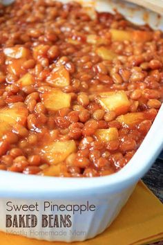 sweet pineapple baked beans in a white dish