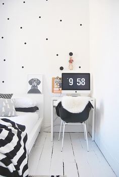 a white room with black and white decor