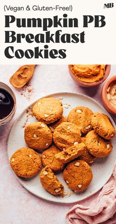 a white plate topped with cookies next to a cup of coffee and muffins