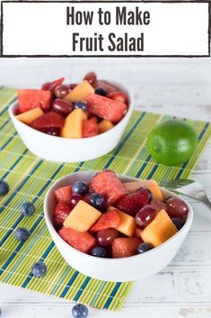 two bowls filled with fruit sitting on top of a table