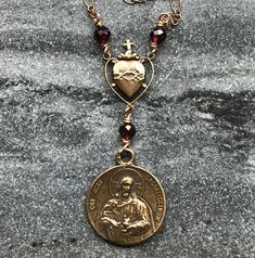 Sacred Heart of Jesus Necklace Solid bronze chain, wire and medal Garnet Gemstones *All bracelets and necklaces can be adjusted to any size. Please send me a messages with your desired length. Jesus Necklace, Jewelry Staples, Bronze Necklace, Daily Jewelry, Heart Of Jesus, Garnet Gemstone, Sacred Heart, Star Necklace, Heart Necklace