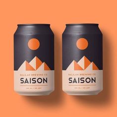 two cans of saison on an orange background