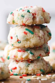 three cookies stacked on top of each other with sprinkles and colored sugar