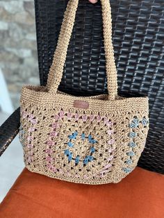 Our bag is carefully crochered from twisted natural Raffia rope. It has cotton fabric lining and 3 pockets inside. You may complete your combination with this stylish bag that will accompany you on daily use or special occasions. Measurements: 38 x23x12cm 15x9x4,7 in Strap : 59 cm (23,32 in) *Metal magnetic button closure *3 interior pockets.  *Cotton fabric Lining  * Made by hand with love and care Attention: Please do not wash, wipe gently with a damp cloth only. Casual Cream Crochet Bag Woven Style, Casual Cream Woven Crochet Bag, Beach Shoulder Bag In Cotton, Cream Cotton Beach Bag For Vacation, Beige Cotton Shoulder Bag For Vacation, Vacation Beige Cotton Shoulder Bag, Casual Beige Jute Beach Bag, Casual Cream Jute Bag, Beige Jute Crochet Bag