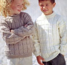 two young children standing next to each other