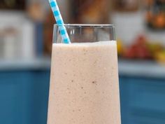 a smoothie with a blue and white striped straw