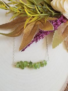 Peridot: The birthstone for August. A crystal rich in culture, mysticism and healing power. A stone that helps to boost the confidence of those wearing it, as well as attracting luck, love & wealth. Brings peace & harmony to one's life. TWO Piece Necklace Layering Set! Gorgeous raw green Peridot is elegant yet rustic. This is a two piece layering necklace set. Your choice of Sterling Silver or Gold Filled. Solid lobster claw clasp. Details: * Natural raw Perdiot nugget chips Size: Betwee Green Crystal Necklaces For May Birthstone, Spiritual May Birthstone Crystal Necklace, Peridot Gemstone Beads Necklace As Gift, Peridot Gemstone Beads Necklace For Gift, Peridot Gemstone Bead Necklace For Gift, May Birthstone Crystal Necklace For Healing, Peridot Jewelry With Natural Stones For Healing, Green Crystal Stone Necklaces For Gift, Green Crystal Necklaces With Stones As Gift