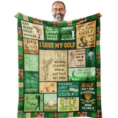 a man is holding up a blanket with golf related items on it and the words i love my golf written in different languages