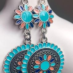 Silver Metal With Pretty Enameled Colors In Turquoise, Navy Blue And Orange. The Colors Really Pop! Great Summertime Earrings. Top Piece Is A Flower Shape Which Measures 1/2" Diameter. Attached To This Is A Round Piece Which Measures 1" Diameter. * French Wire Hooks W/ Clear Rubber Stoppers * Earrings Dangle Down Approx. 2 3/8" * Lightweight * Brand New Questions And Offers Always Welcome - Thank You! Vibrant Adjustable Blue Jewelry, Adjustable Vibrant Blue Jewelry, Vibrant Blue Adjustable Jewelry, Bohemian Light Blue Flower Jewelry, Blue Southwestern Style Jewelry For Summer, Southwestern Blue Jewelry For Summer, Vibrant Blue Drop Earrings, Blue Southwestern Style Summer Jewelry, Multicolor Bohemian Nickel-free Flower Earrings